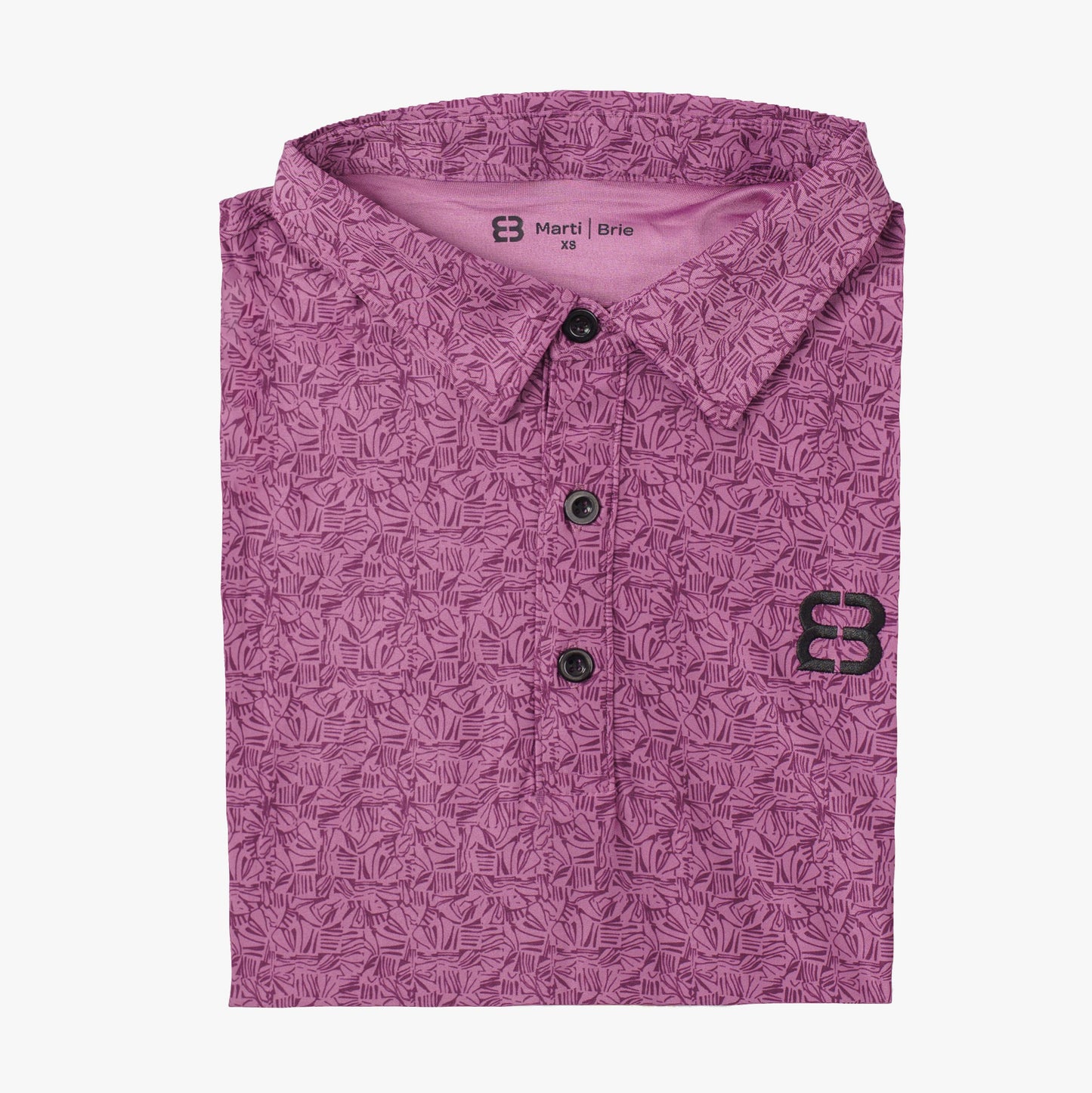 Purple patterned shirt with a marti and brie brand logo on a white background